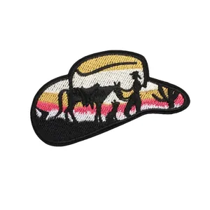 Western cowboy hat embroidered iron-on patch featuring sunset landscape silhouette