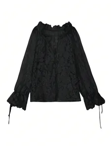 Detailed view of black hollow-out lace shirt with elegant floral embroidery patterns