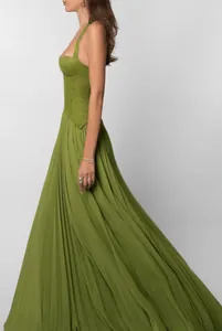 Elegant olive green maxi dress with lace bodice and pleated skirt details.