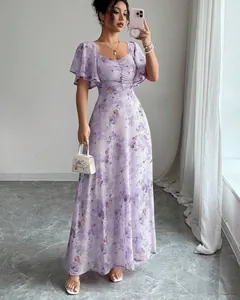 Detail of elegant purple floral maxi dress with ruffle sleeves and slim fit design
