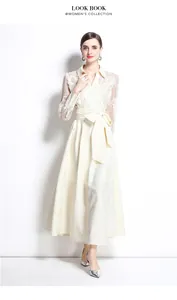 Elegant ivory long dress with lace embroidery sleeves and textured polo collar design.