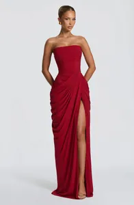 Elegant red strapless maxi dress featuring asymmetrical pleats and high leg slit detail