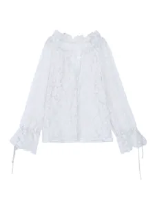 Close-up detail of white hollow lace casual shirt with elegant floral patterns