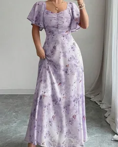 Detail of a purple floral butterfly print maxi dress with elegant flutter sleeves.