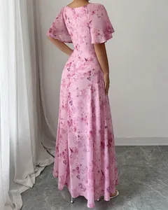 Back view of an elegant pink floral maxi dress with butterfly sleeves and prints.