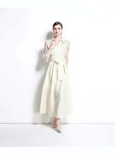 Elegant ivory Polo neck maxi dress with lace embroidery and a belted waist detail.