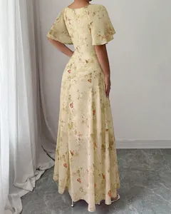 Back view of elegant yellow floral maxi dress with butterfly print and flutter sleeves