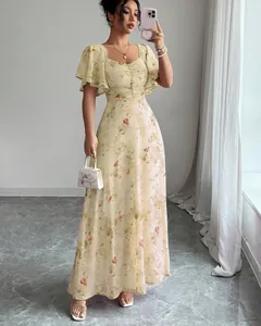 Elegant floral maxi dress with butterfly print and butterfly sleeves for a chic summer look.