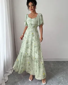Elegant floral maxi dress with butterfly print and ruffled sleeves for summer style