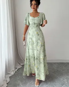 Elegant sage green maxi dress featuring a floral butterfly print and stylish ruffle sleeves.