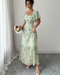 Full-length view of an elegant light green floral print maxi dress with ruffle sleeves