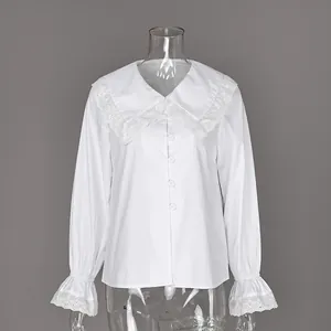 Elegant white French cotton blouse featuring detailed lace collar and flare sleeves