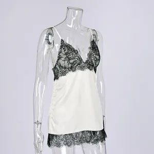 Elegant white satin camisole featuring black lace trim and thin straps for a modern look