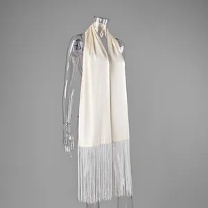 Elegant cream satin waist sash belt featuring long fringe detailing on a mannequin
