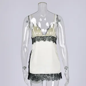 Back view of elegant white satin camisole featuring delicate black lace trim detailing