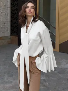 Elegant white satin blouse with pussy-bow necktie and ruffled flare sleeves on model