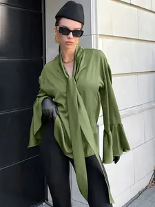Detailed shot of olive green satin blouse with elegant bow tie and ruffled sleeves