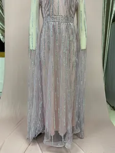 Detailed view showing the silver sequin fringe patterns on this pink mesh evening dress.