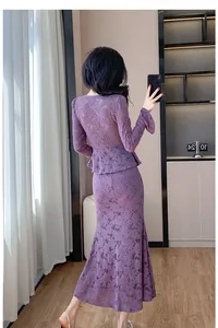 Detailed back view of the purple lace top with flared sleeves and long mermaid skirt