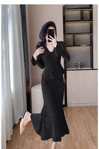 Elegant black lace two-piece set featuring V-neck flared sleeve top and mermaid skirt.