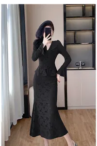 Elegant black lace two-piece set featuring V-neck top and fishtail midi skirt.