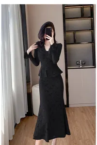 Full length detail of black lace two-piece set with V-neck top and mermaid skirt