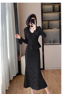 Elegant black lace two-piece set featuring V-neck flared sleeve top and mermaid skirt