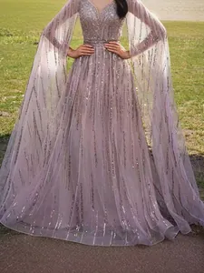 Stunning lavender mesh evening dress with sequin vertical stripes and cape sleeves.