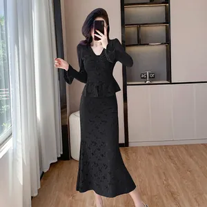 Elegant black V-neck lace top and mermaid skirt two-piece set for women.