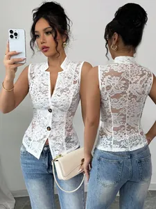 Close-up of white floral lace sleeveless cardigan showing detailed hollow-out texture.