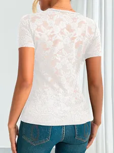 Detailed back view showing the intricate floral lace pattern of this white slim fit top