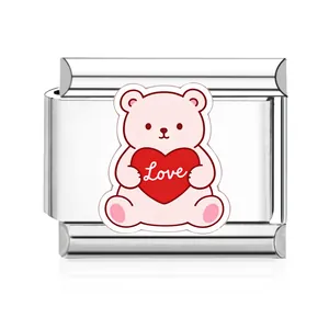 Detailed macro view of a stainless steel Italian link charm with a pink heart bear.