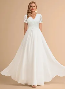 Elegant full-body view of lace bodice and flowing chiffon skirt on white evening dress