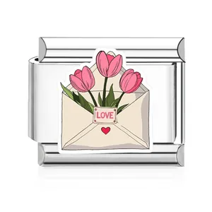 Close-up of stainless steel Italian charm with pink tulip envelope enamel design