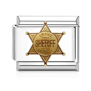 Detail shot of a stainless steel Italian charm with a golden sheriff star badge.