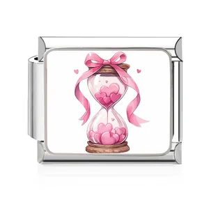 Close-up of stainless steel Italian charm link with pink heart hourglass design