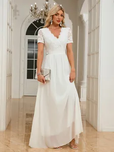 Elegant white v-neck dress featuring lace bodice and flowing chiffon maxi skirt