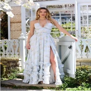Detailed view of elegant light blue floral maxi dress with high slit and ruffles