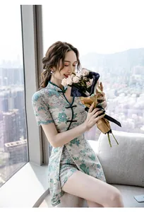 Detail view of modern lace Qipao dress with elegant floral pattern and high collar