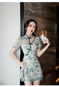 Elegant teal lace modified Cheongsam two-piece set featuring hollow floral patterns and stand collar