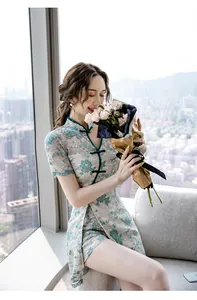 Elegant lace cheongsam dress worn by a model in a bright modern city lifestyle setting