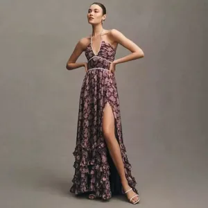 Elegant floral print halter maxi dress with ruffle hem and pearl waist detail