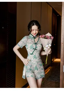 Detailed view of an elegant modern lace Qipao set with green floral pattern and slim fit