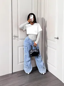 Sexy white patchwork bodysuit featuring sheer floral lace sleeves and knit crop top overlay