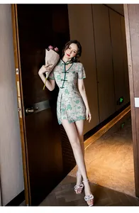 Elegant modern lace cheongsam dress featuring green floral patterns and slim fit cut