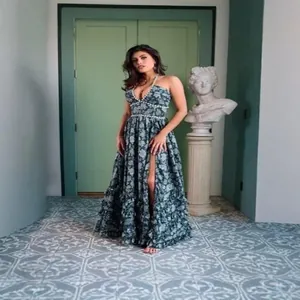 Elegant floral print maxi dress featuring a high slit and pearl trim for holidays