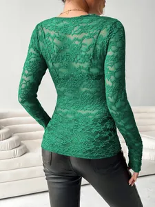 Detail view of the green floral lace long-sleeve top showing back texture and slim fit.