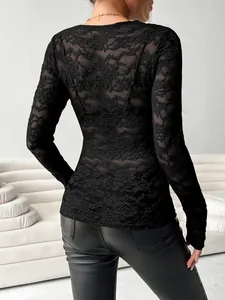 Detailed back view of a slim-fit black floral lace long-sleeved top for women