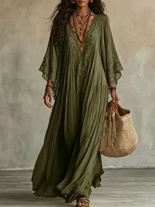 Detail of olive green lace V-neck maxi dress with batwing sleeves in a boho beach style