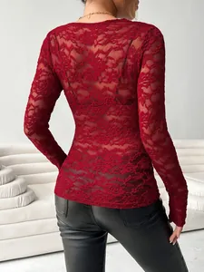 Detailed back view of an elegant red floral lace long-sleeve top with scalloped edges